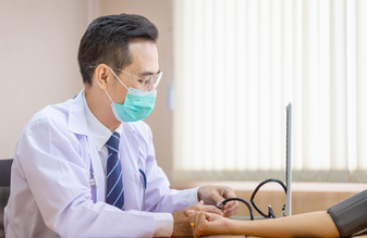 Picture of clinician checking blood pressure